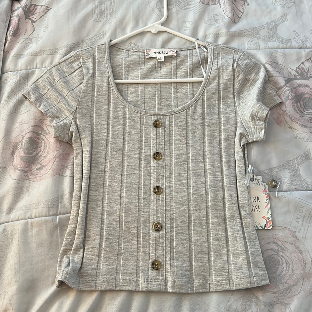 Gray top with buttons.